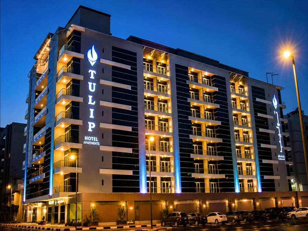 Tulip Hotel Apartments building in Mankhool, Dubai, at dusk